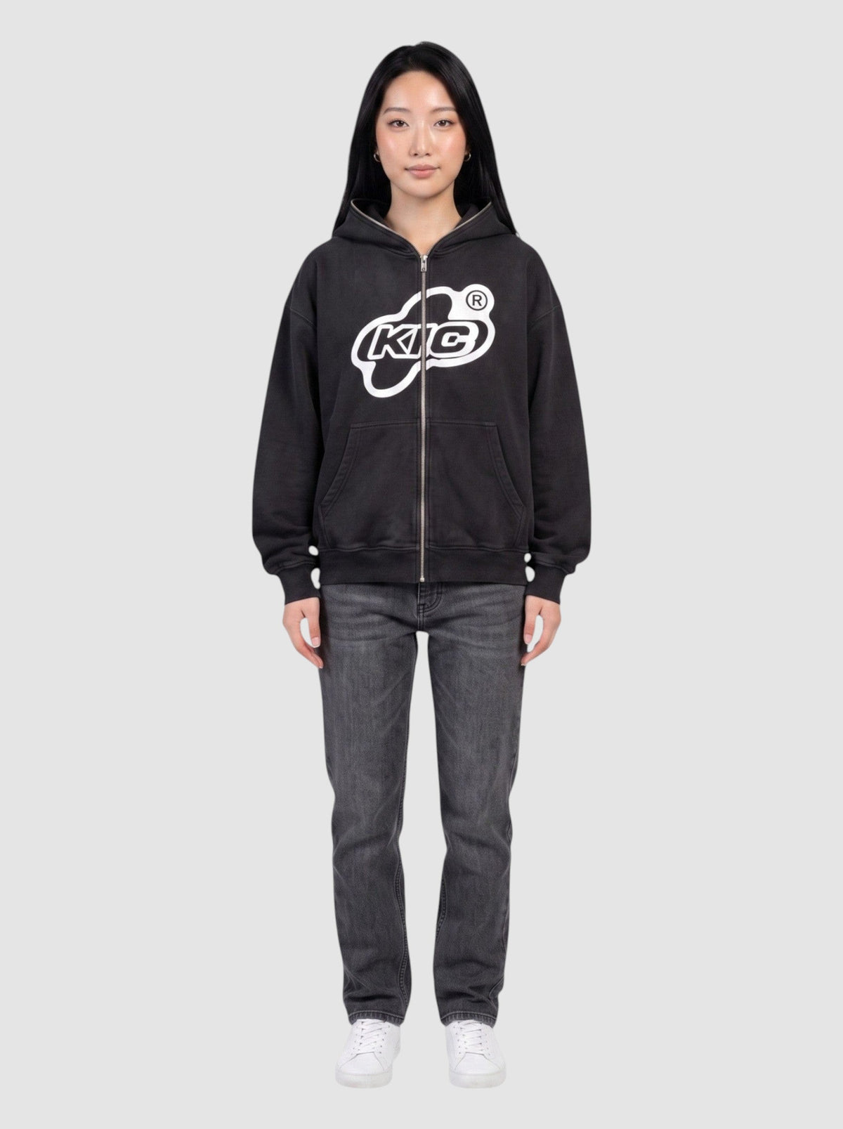 Y2K Studio black oversized zip-up hoodie with white bubble logo and contrast piping on a model