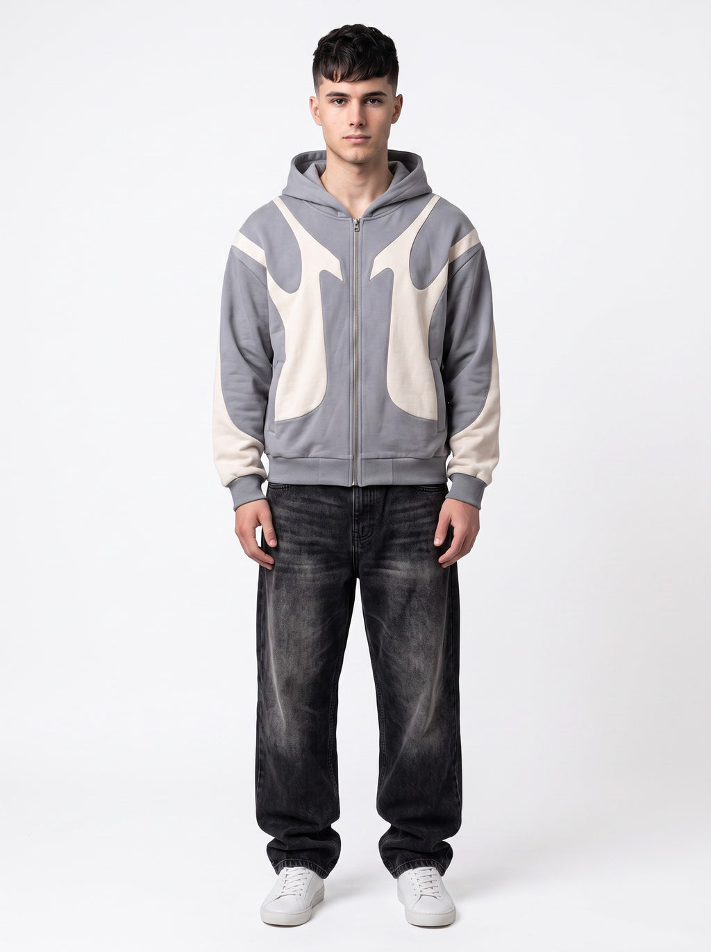 Model wearing Y2K Studio grey and cream flame panel zip-up hoodie paired with black baggy jeans