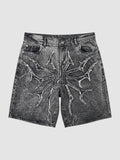 Y2K Studio acid wash black denim jorts featuring a distressed thorny star appliqué with raw frayed edges.