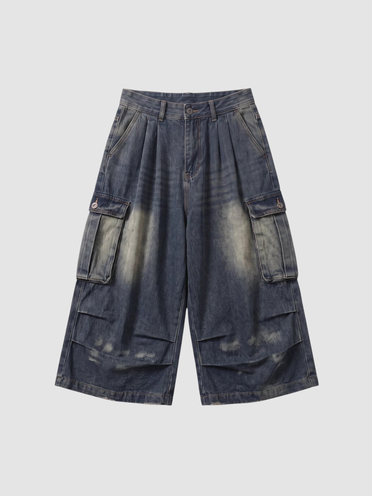 Y2K Studio baggy cargo denim shorts in a faded blue wash with large side pockets and a high-waisted pleated fit.