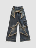 Y2K Studio high-waisted baggy cargo jeans in indigo denim with frayed star-shaped patchwork and side cargo pocket.