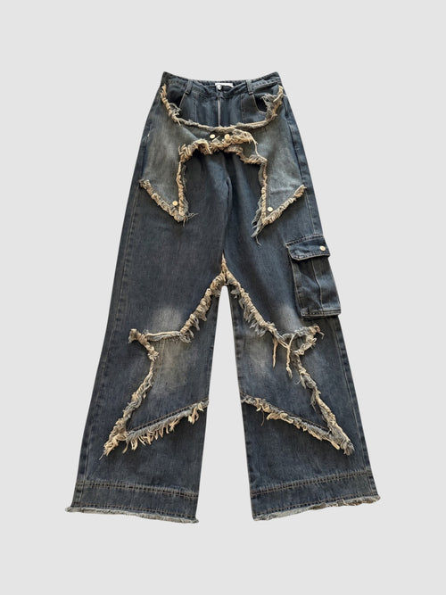 Y2K Studio high-waisted baggy cargo jeans in indigo denim with frayed star-shaped patchwork and side cargo pocket.