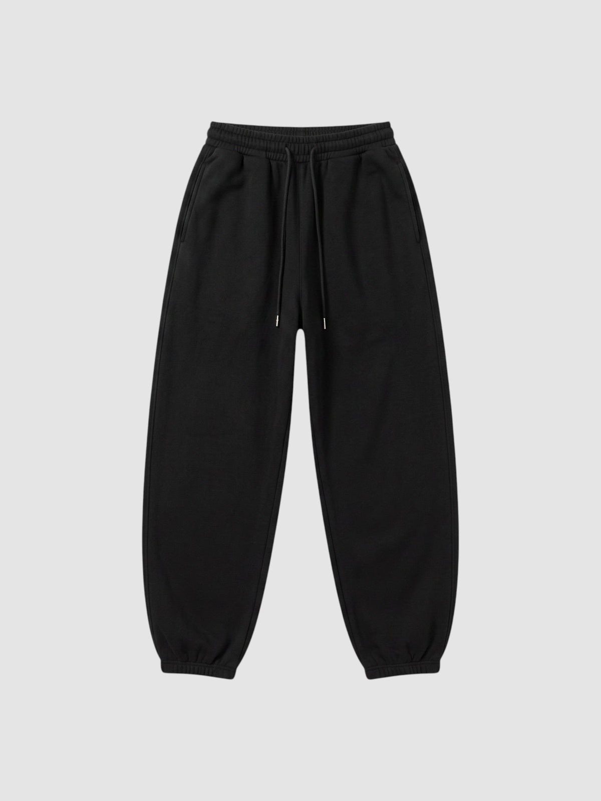 Y2K Studio black barrel leg sweatpants with a high elastic waist, drawstring, and deep side pockets.