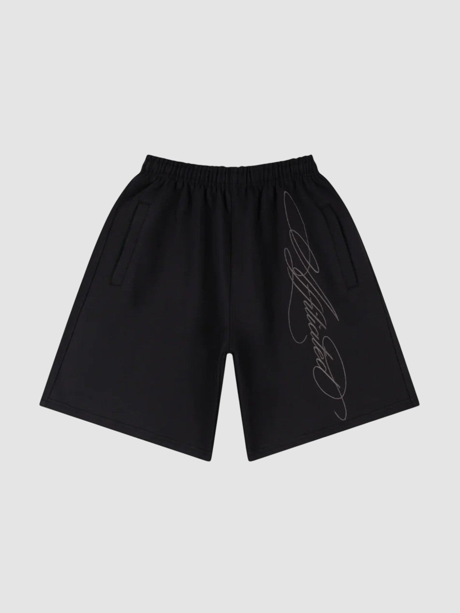 Y2K Studio black fleece shorts with diagonal cursive calligraphy print, elastic waist, and side pockets.