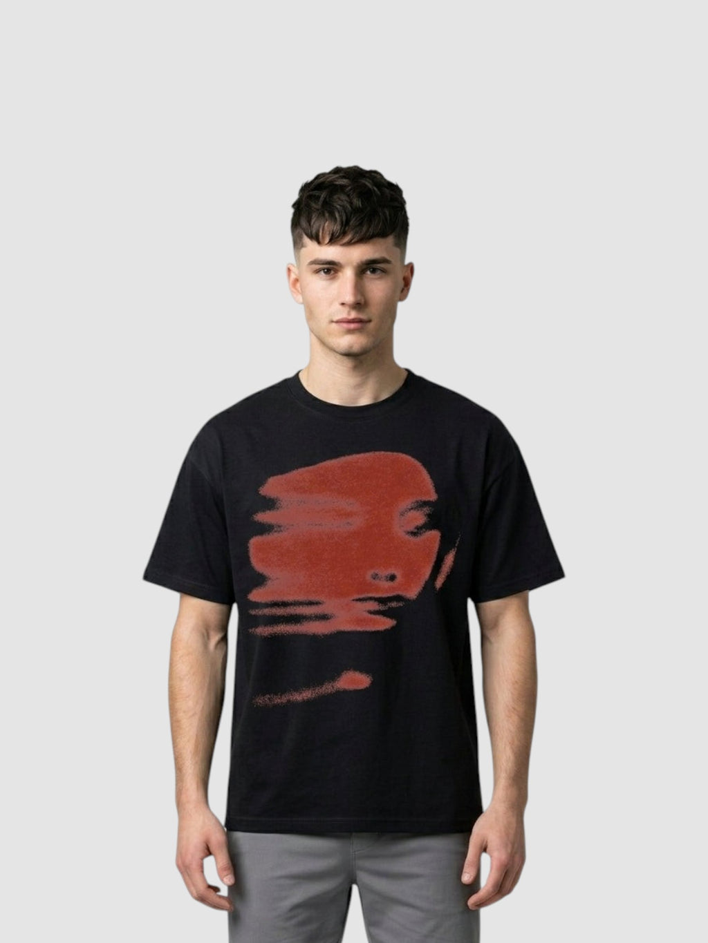 Y2K Studio black unisex cotton t-shirt featuring a blurred brick red abstract face print on the chest