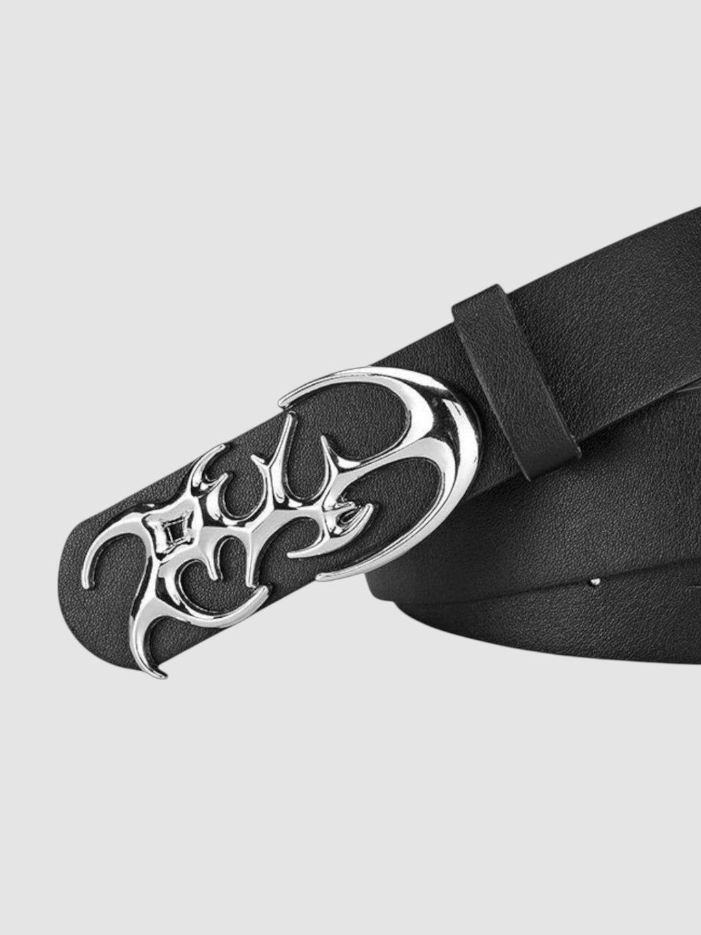 Y2K Studio black faux leather belt featuring a shiny silver asymmetrical flame-shaped metal buckle
