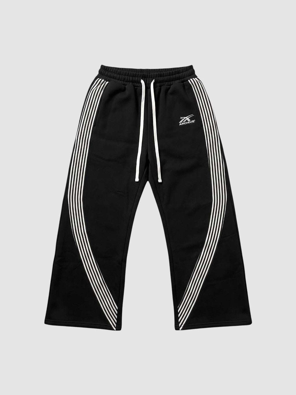 Y2K Studio black fleece baggy joggers with white side stripes and embroidered logo on the left thigh