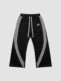 Y2K Studio black fleece baggy joggers with white side stripes and embroidered logo on the left thigh