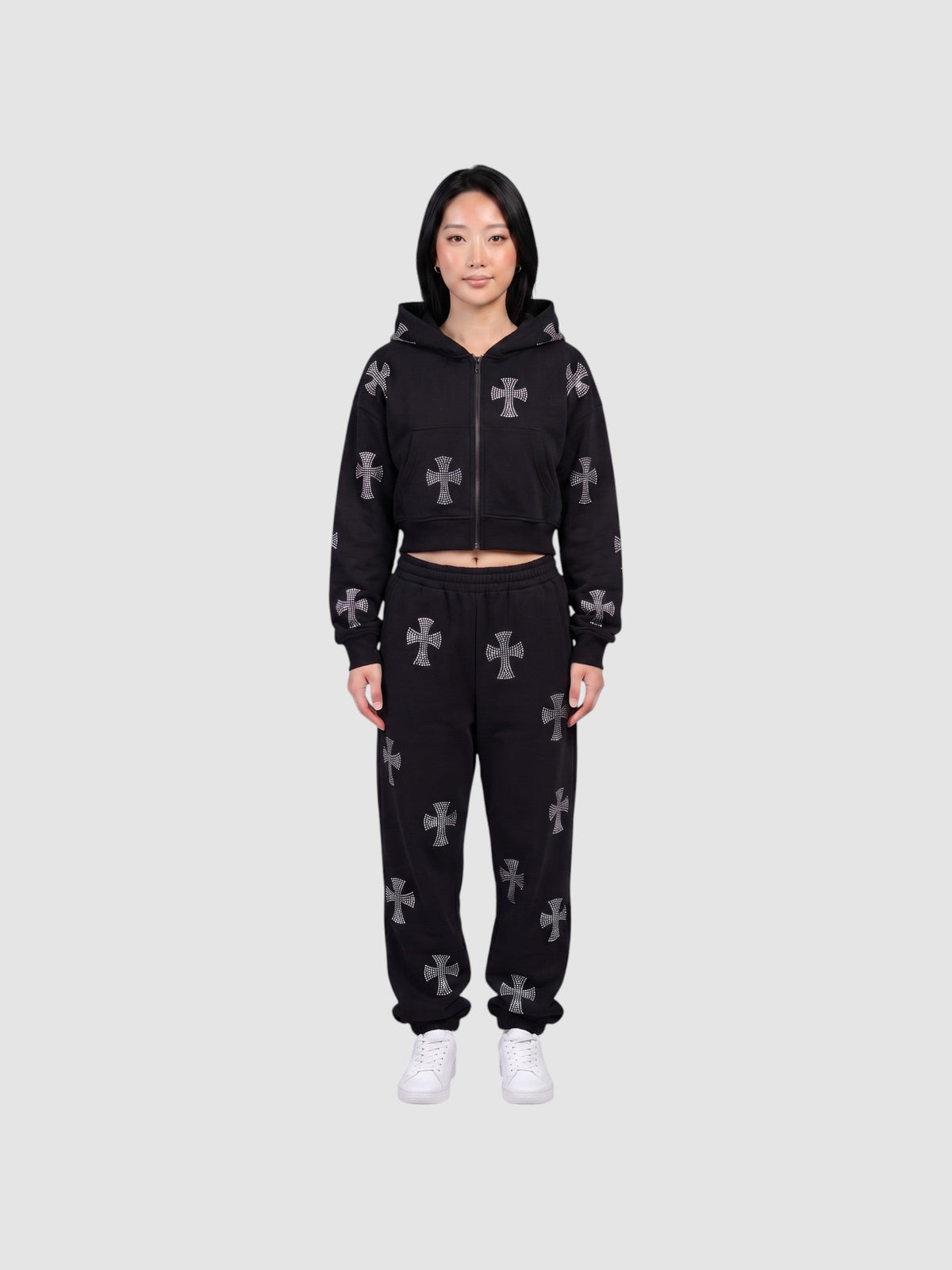 Y2K Studio black gothic zip-up hoodie and matching sweatpants set with grey cross patterns worn by a model