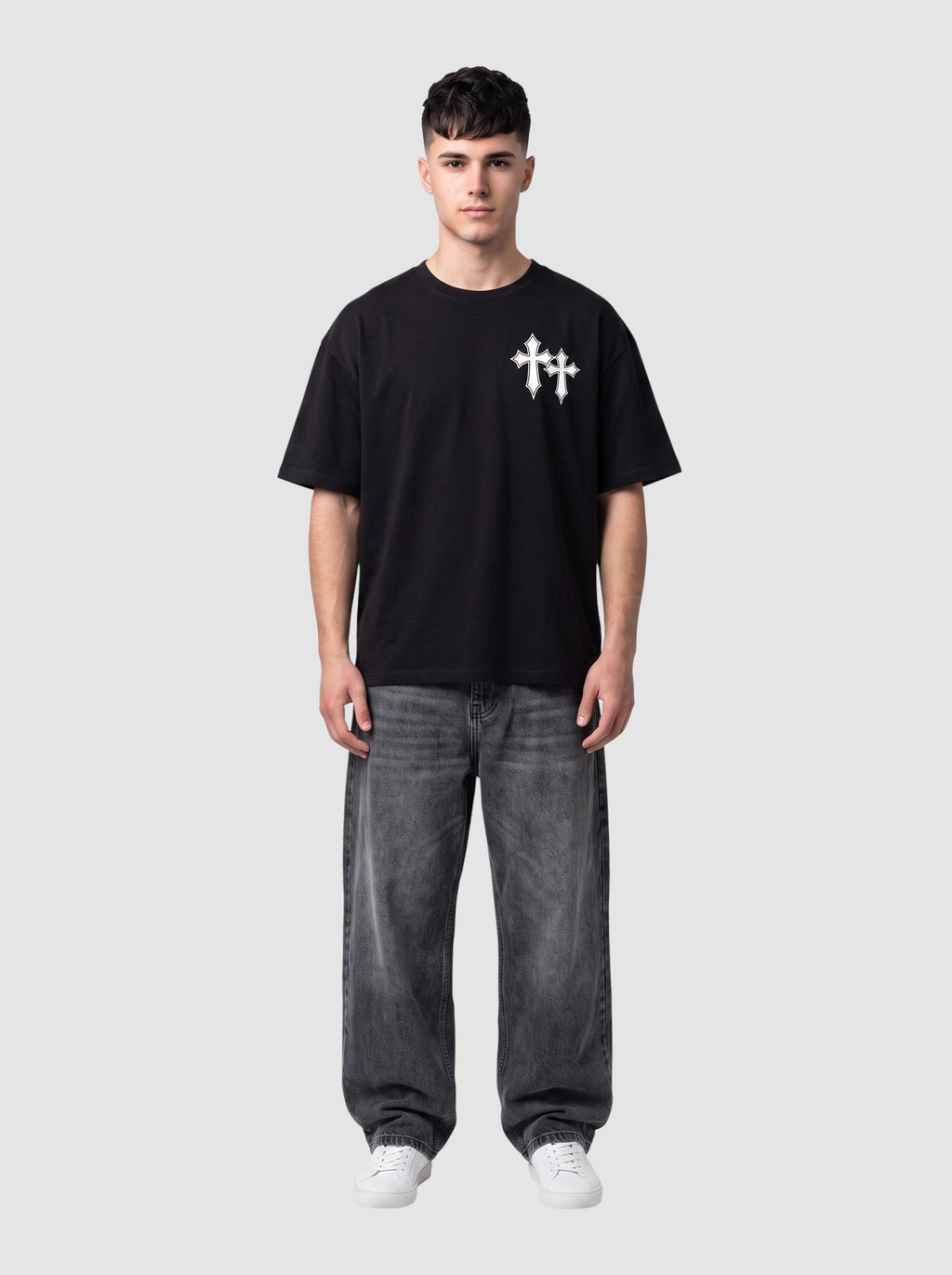 Y2K Studio black oversized cotton t-shirt with white gothic cross print on chest worn by a male model