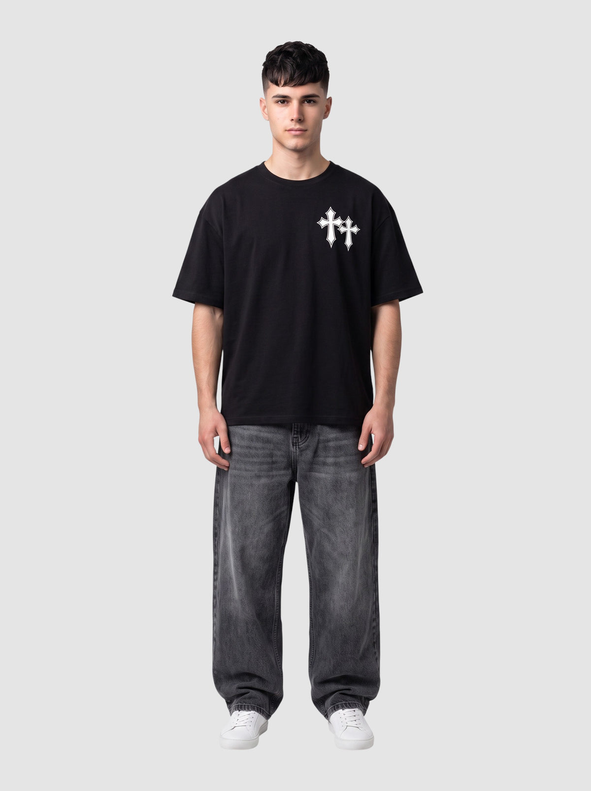 Y2K Studio black oversized cotton t-shirt with white gothic cross print on chest worn by a male model