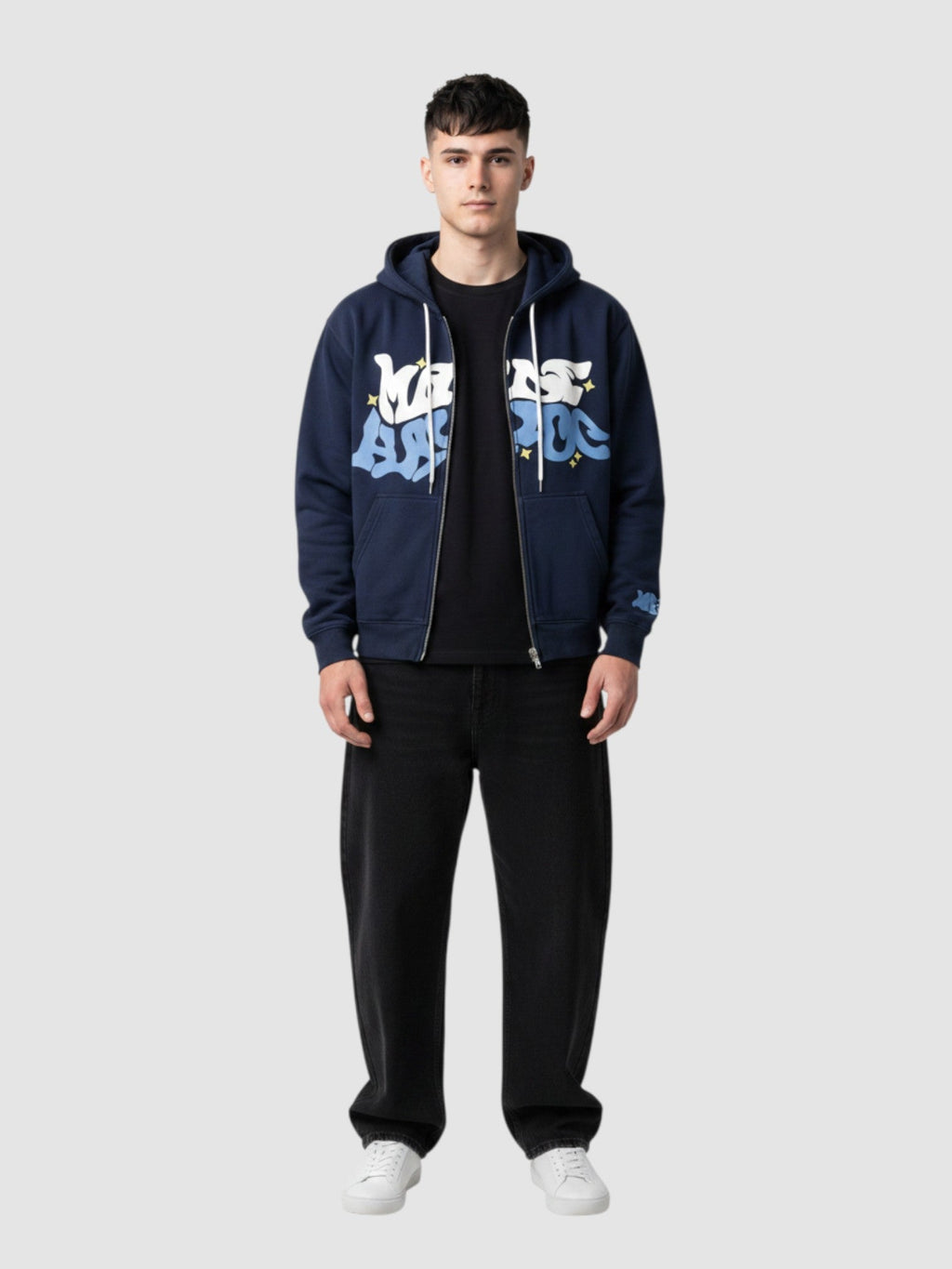 Y2K Studio black zip-up hoodie featuring white and blue bubble graffiti lettering and green star accents on a model