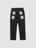 Y2K Studio black straight-leg denim jeans featuring white mask face prints on the back pockets and contrast stitching.