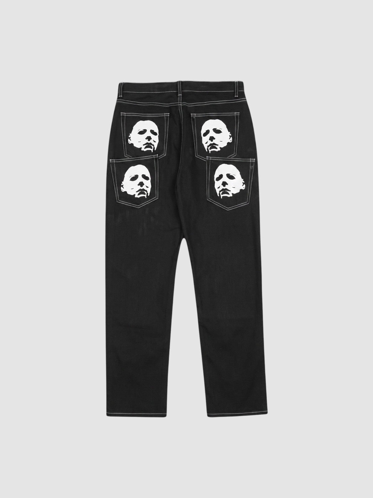 Y2K Studio black straight-leg denim jeans featuring white mask face prints on the back pockets and contrast stitching.