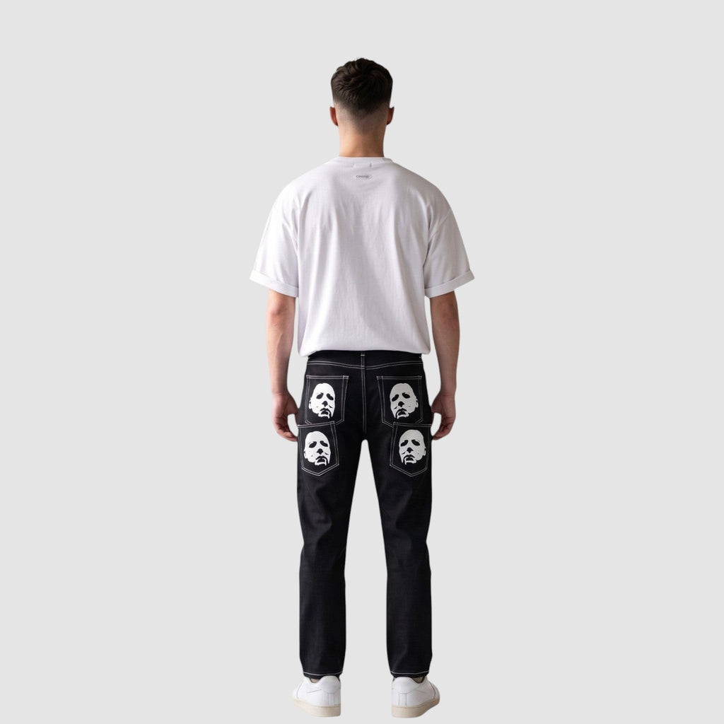 Y2K Studio black straight-leg denim jeans with white mask prints on back pockets and contrast white stitching