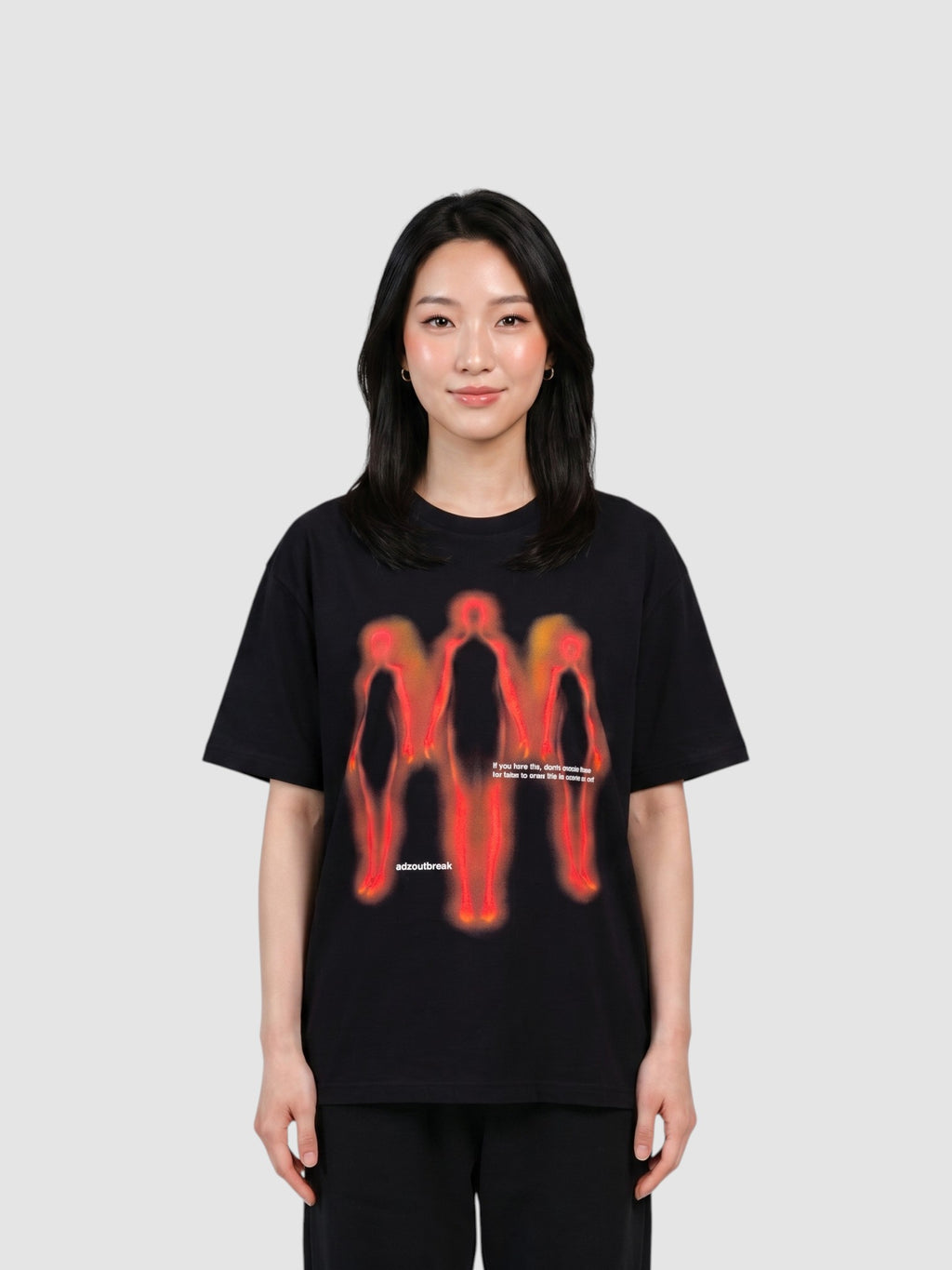 Y2K Studio black oversized cotton t-shirt featuring a red and orange thermal-style human silhouette graphic print.