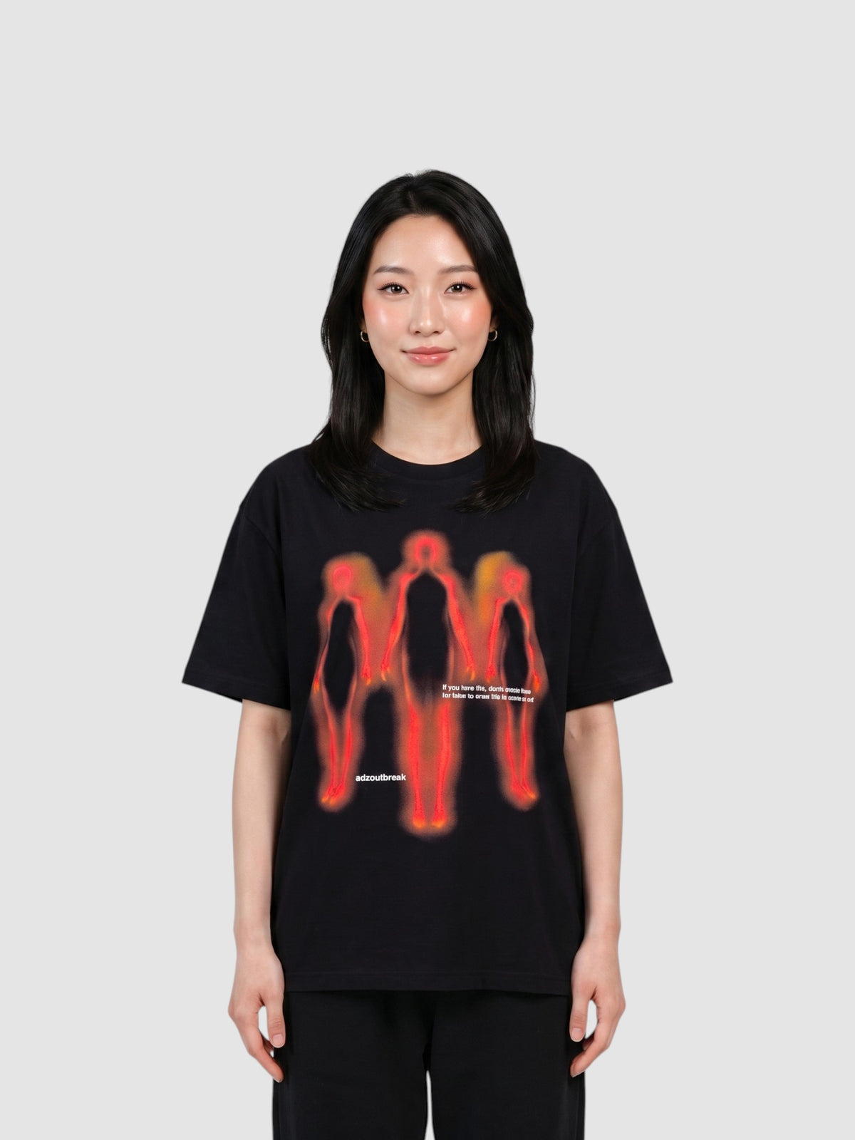 Y2K Studio black oversized cotton t-shirt featuring a red and orange thermal-style human silhouette graphic print.