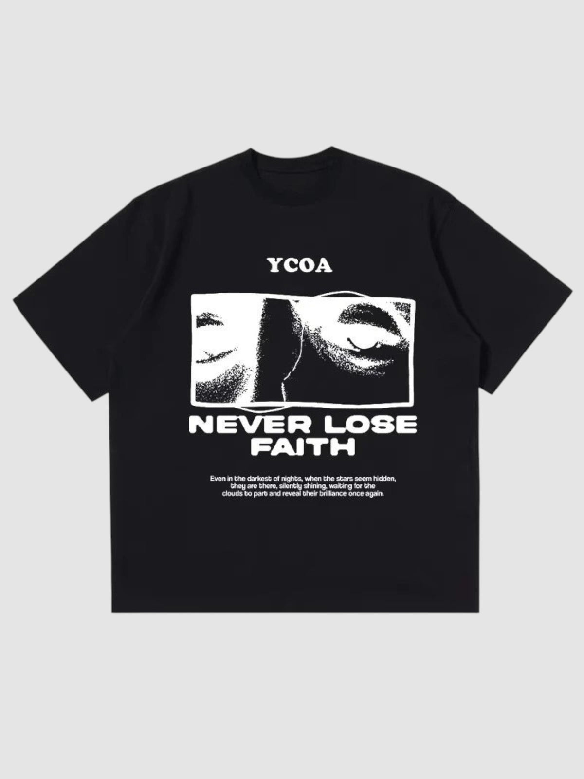Y2K Studio black oversized t-shirt featuring a white graphic print of eyes and the text Never Lose Faith