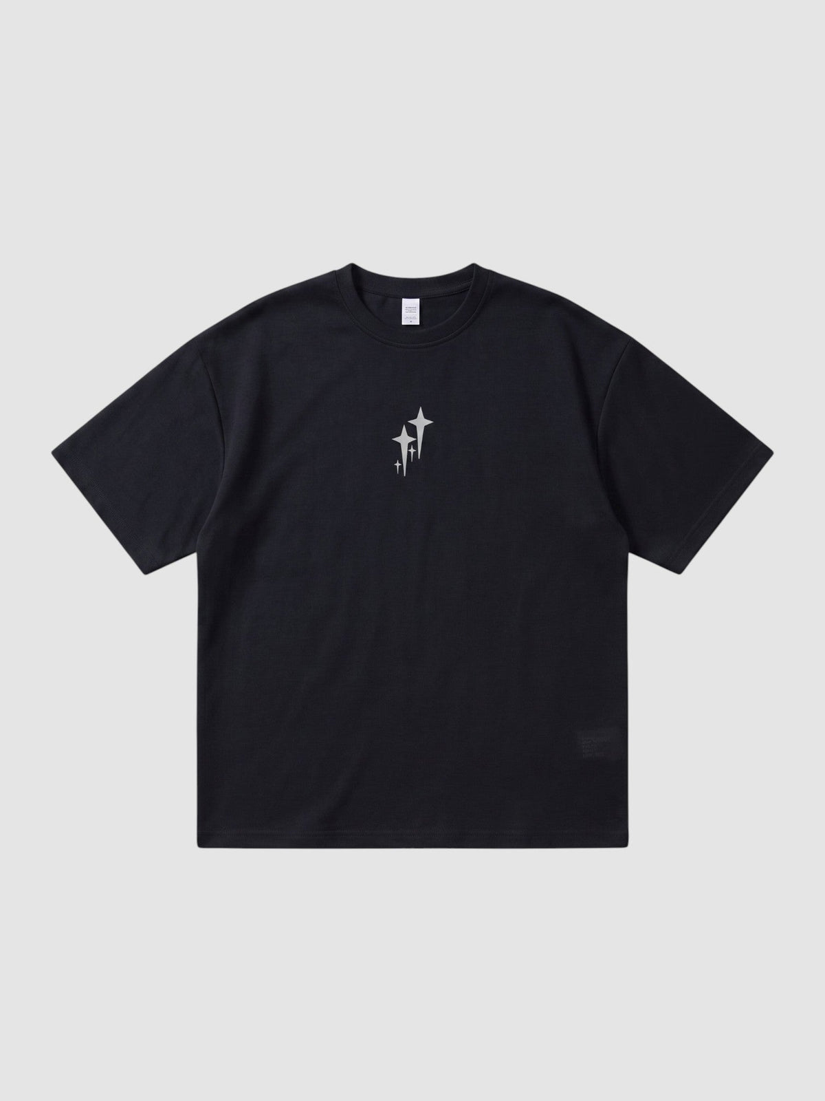 Y2K Studio black oversized t-shirt with chrome star graphic on chest, featuring a ribbed crew neck and drop shoulders.