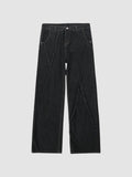 Y2K Studio black wide-leg denim jeans featuring diagonal raw-edge seams and a button fly closure.