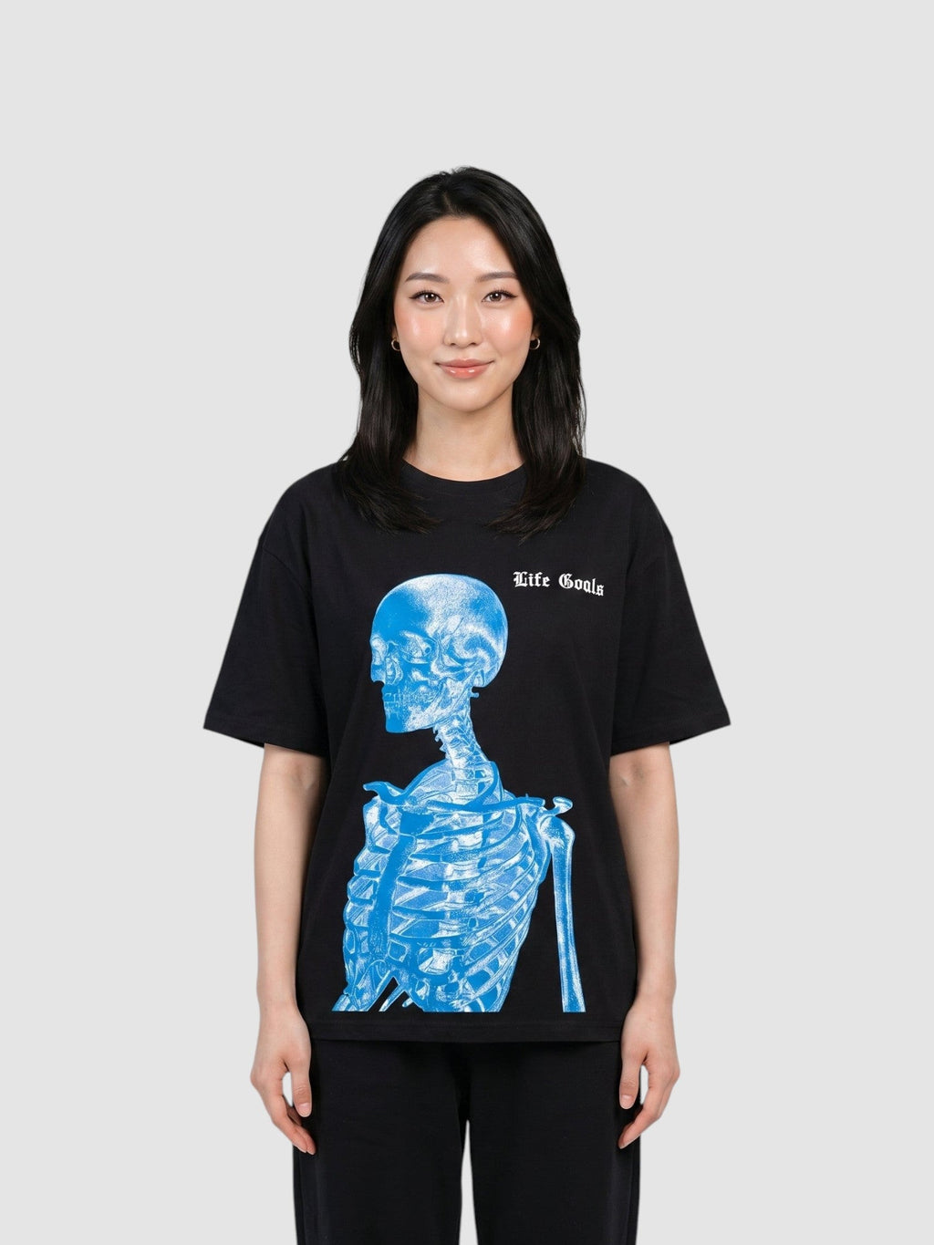 Y2K Studio unisex black cotton t-shirt featuring a blue electric skeleton print and gothic Life Goals text