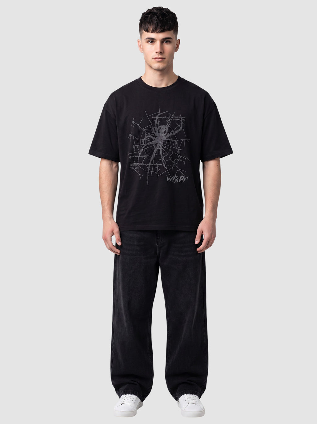 Y2K Studio black oversized t-shirt with a grey spider web graphic, gothic lettering, and a ribbed crew neck.