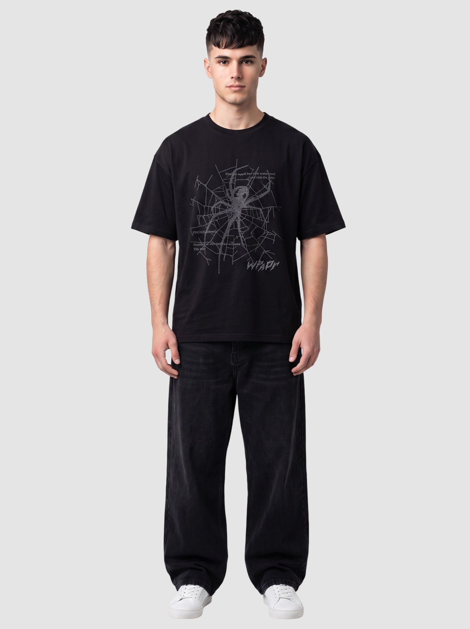 Y2K Studio black oversized t-shirt with a grey spider web graphic, gothic lettering, and a ribbed crew neck.
