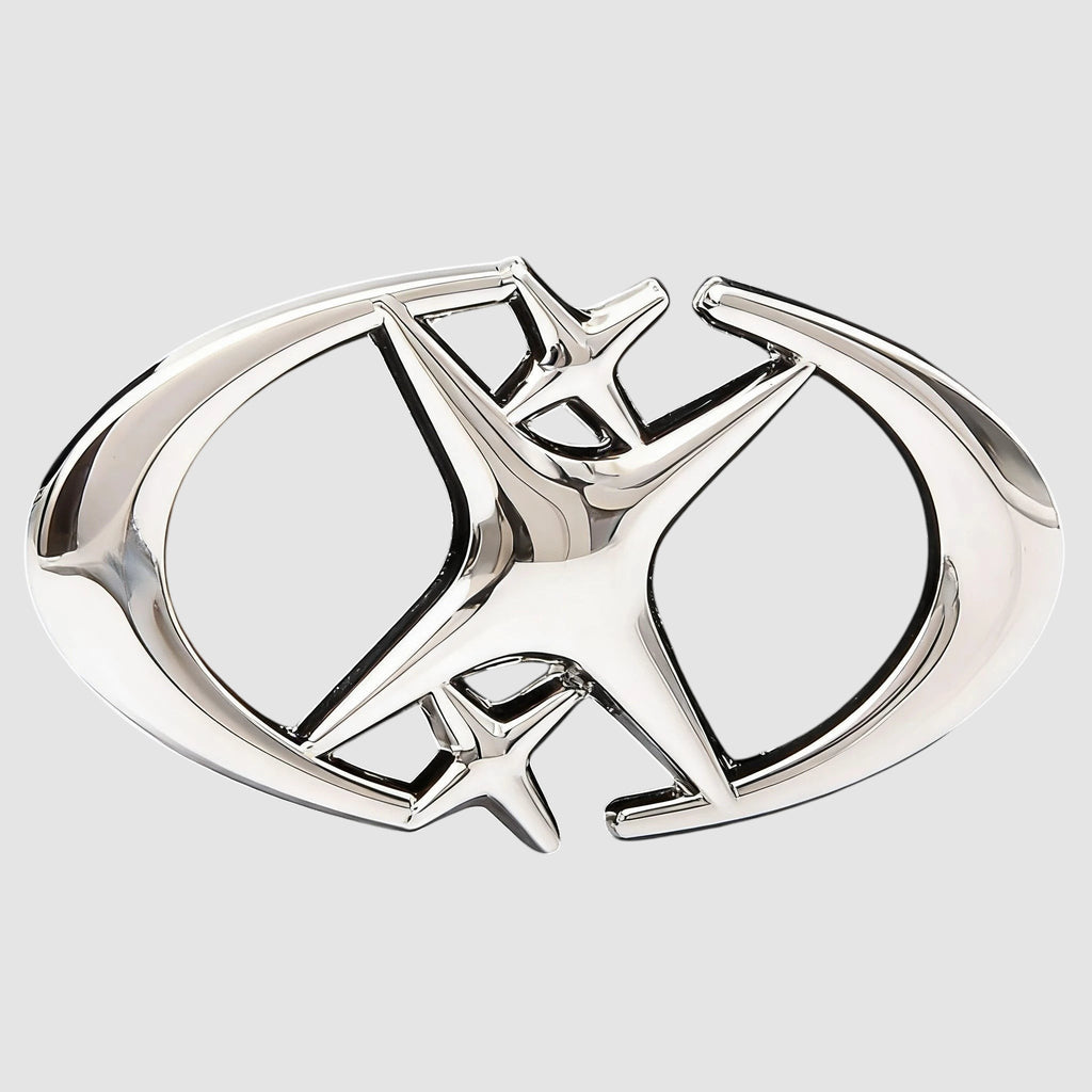 Y2K Studio black faux leather belt featuring a shiny silver star-shaped buckle with curved crescent blade details.