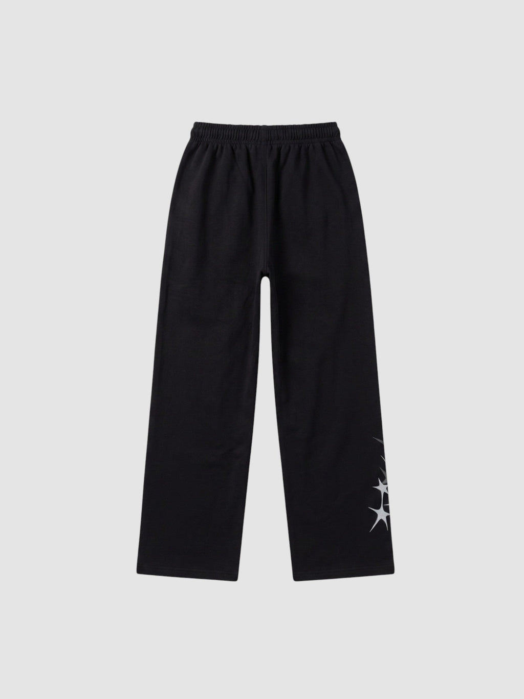 Y2K STUDIO black wide leg jogging pants with grey four-pointed star prints and an elastic drawstring waist.