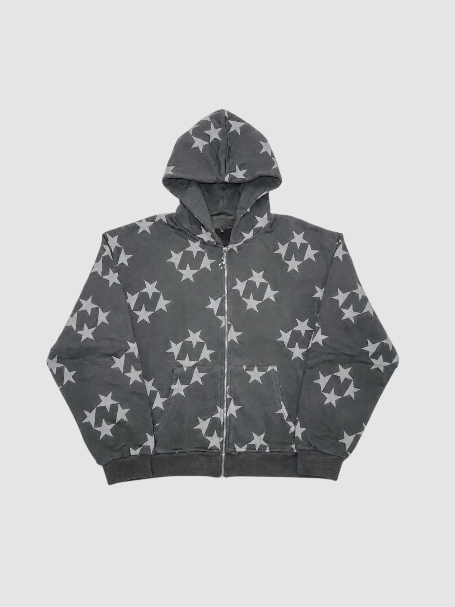 Y2K Studio black zip-up hoodie featuring an all-over grey star pattern, ribbed cuffs, and a standard fit.