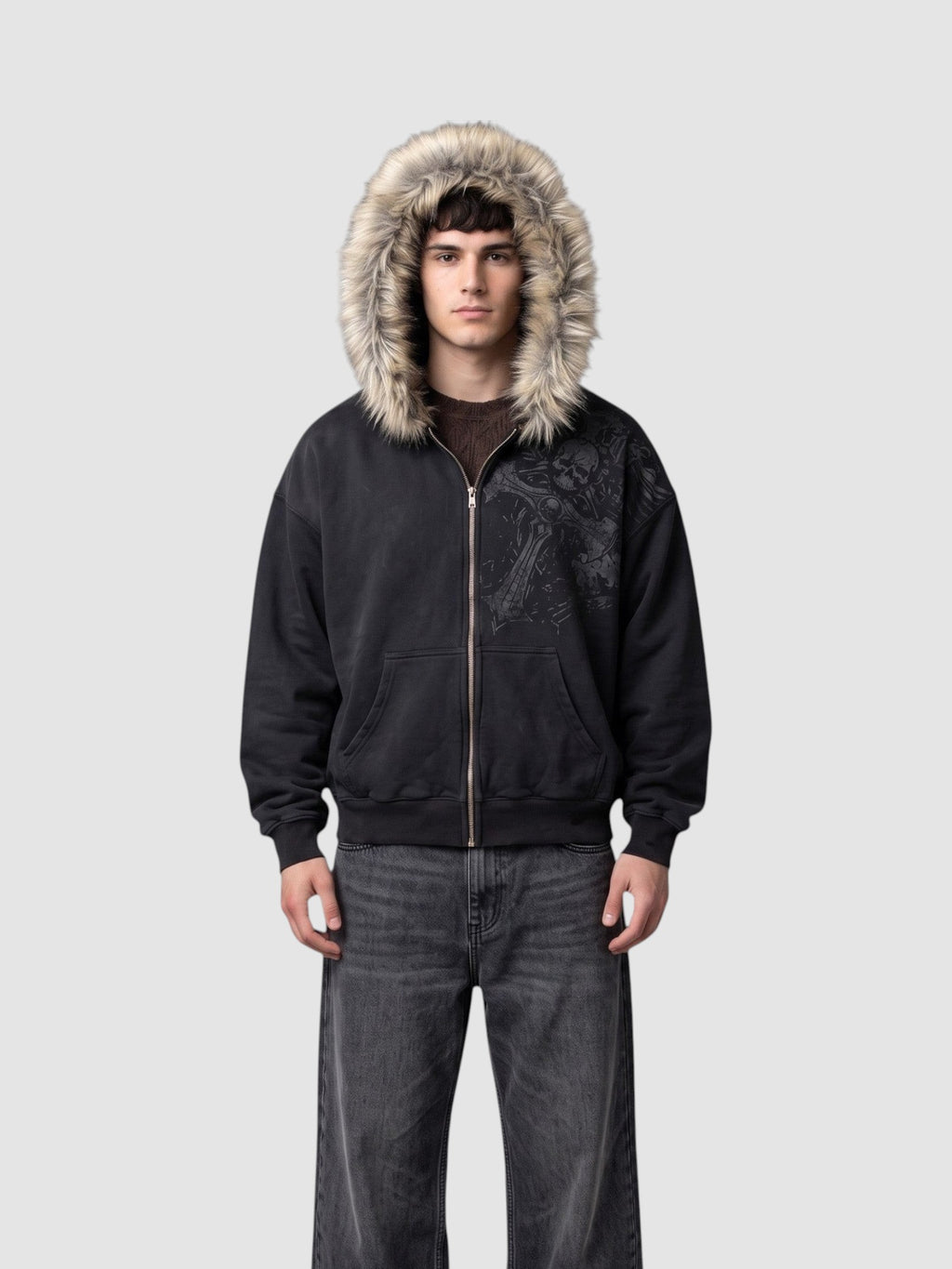 Y2K Studio black washed grunge zip-up hoodie with faux fur hood and silver graphic print worn by a male model