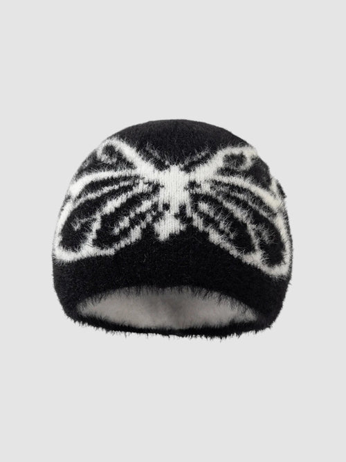 Y2K Studio black and white fuzzy beanie with a butterfly wing pattern in a soft, plush texture.