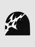 Y2K Studio black acrylic beanie featuring an asymmetrical white stylized lightning bolt graphic pattern.