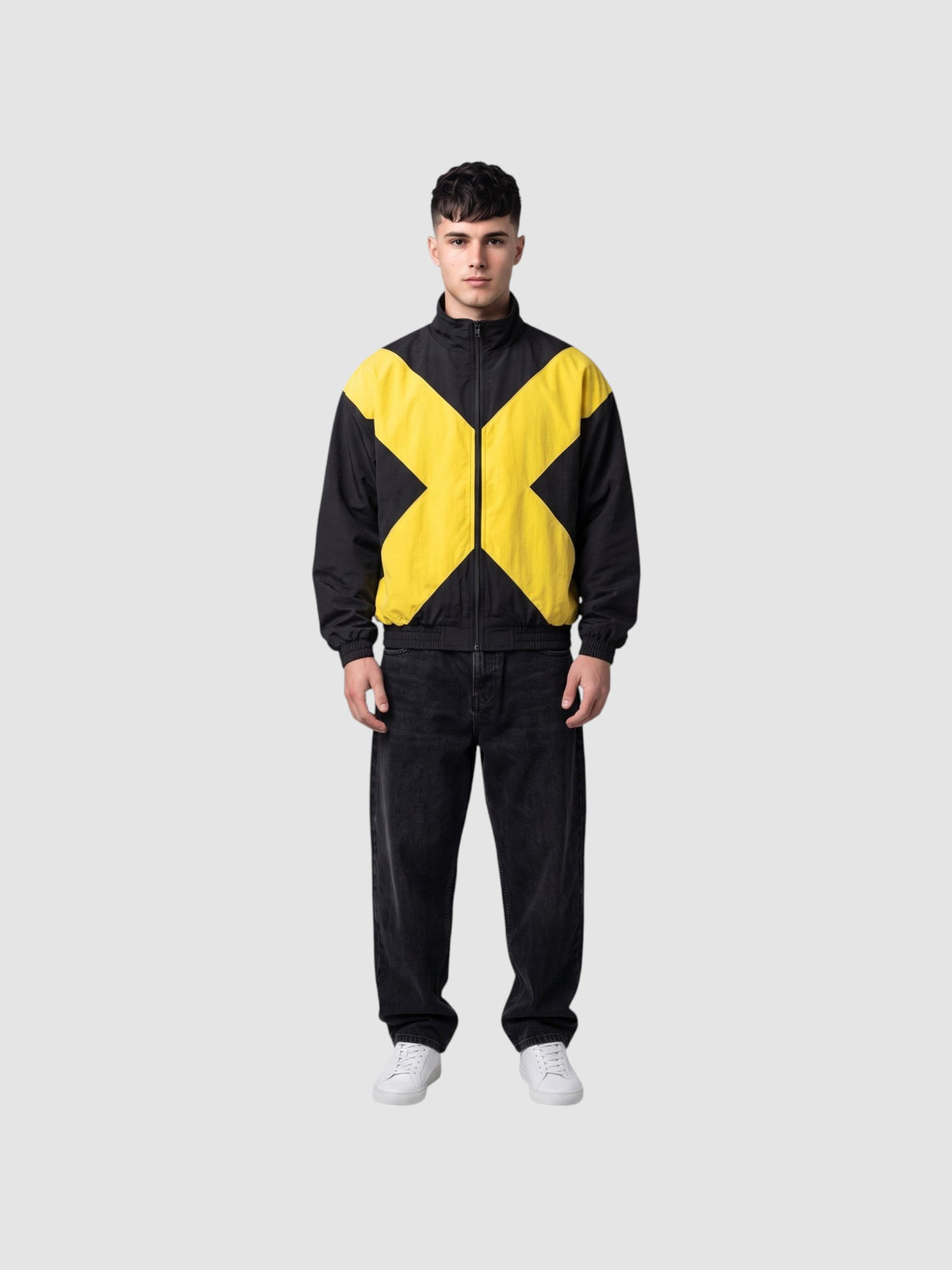 Y2K Studio black and yellow bomber jacket with a large cross design, high collar, and cotton lining on a male model.