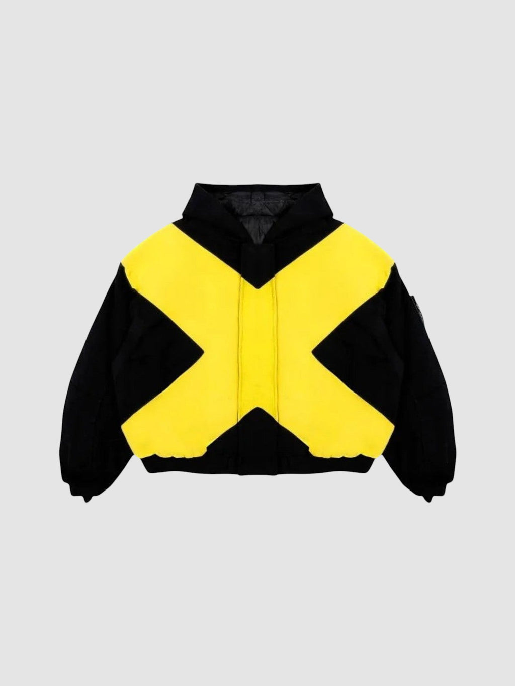 Y2K Studio black and yellow bomber jacket with a large cross design, high collar, and cropped ribbed hem.