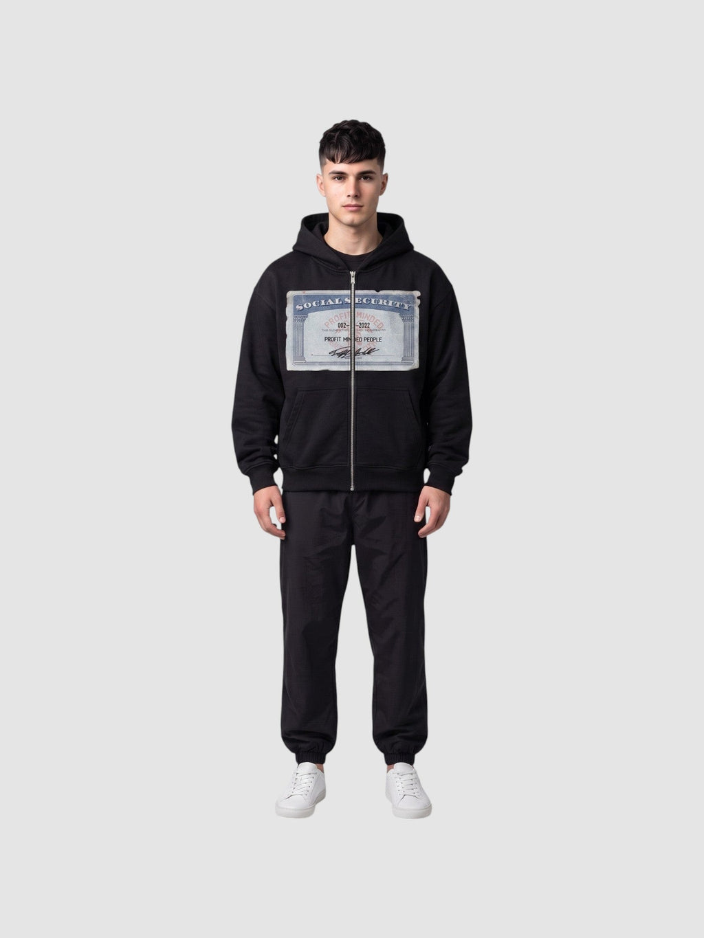 Y2K Studio black zip-up hoodie featuring a Social Security card graphic print on the chest, worn by a male model.