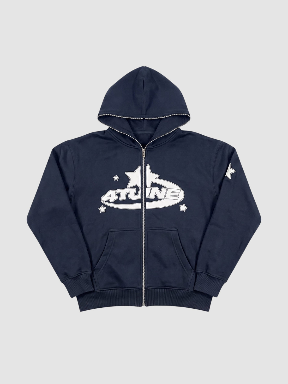 Y2K Studio black zip-up hoodie with white star graphic lettering and fleece lining in a relaxed Y2K aesthetic.