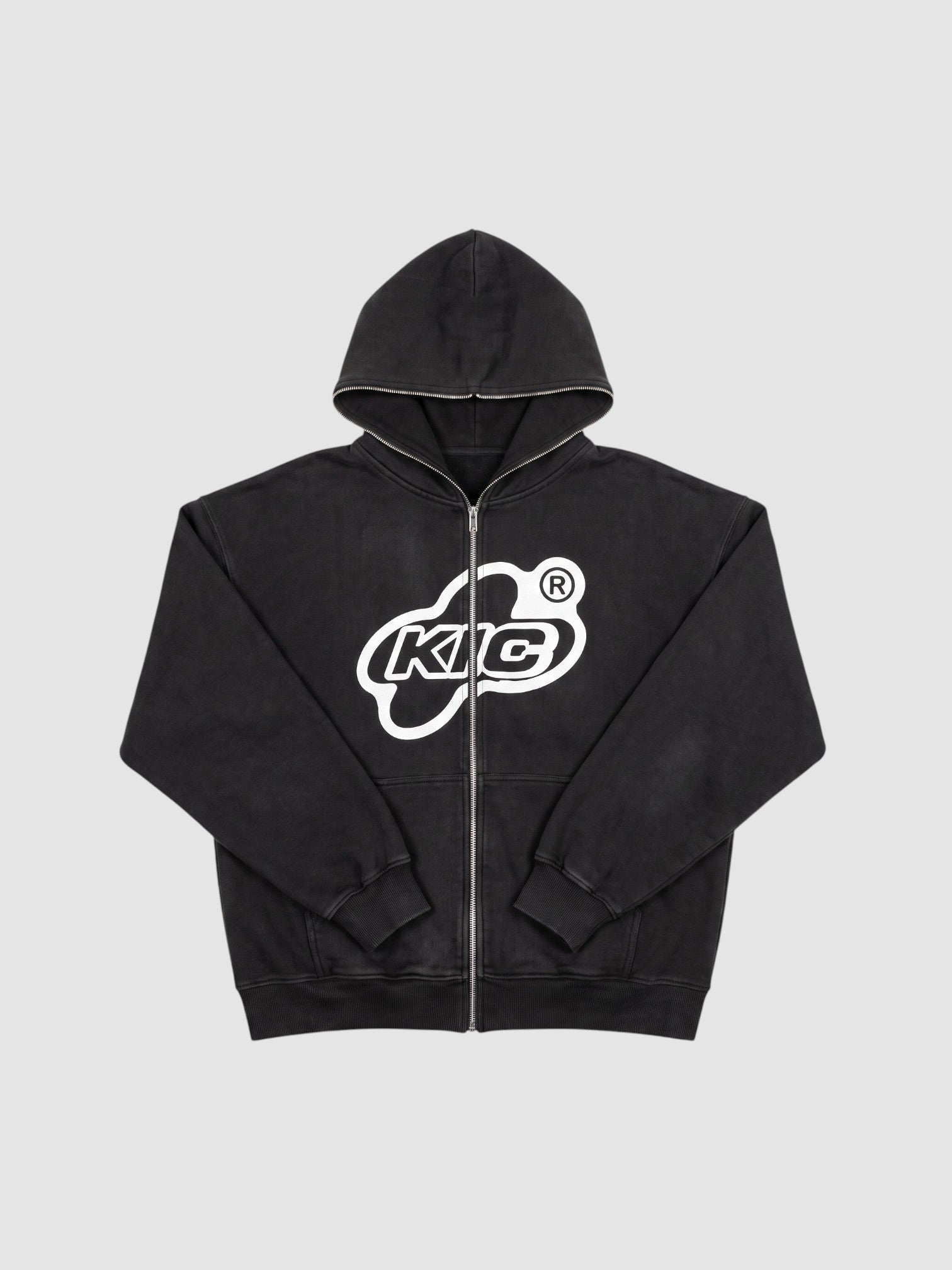 Y2K Studio black zip-up hoodie with white bubble logo, contrast piping on hood and zipper, and oversized fit.