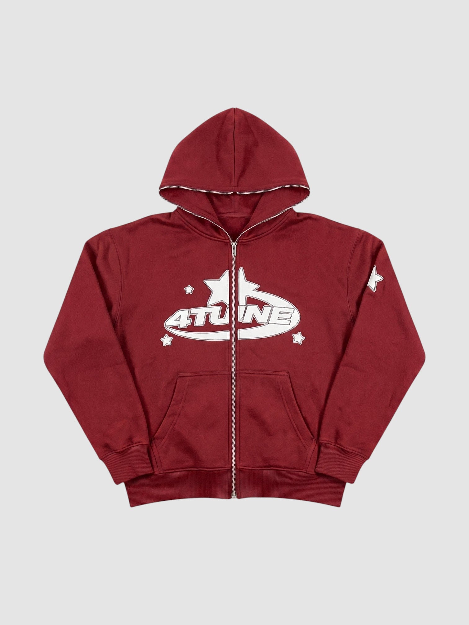 Y2K STUDIO burgundy zip-up hoodie with white star lettering graphic, fleece-lined interior, and oversized fit.