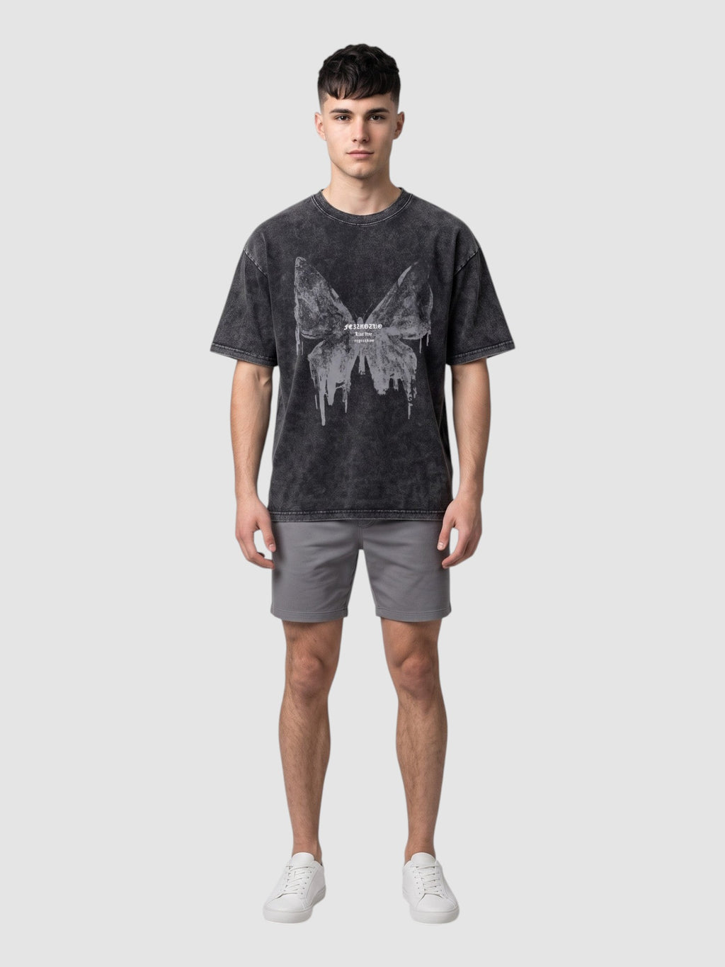 Y2K STUDIO charcoal grey acid-wash t-shirt with a butterfly graphic, worn by a male model with grey shorts