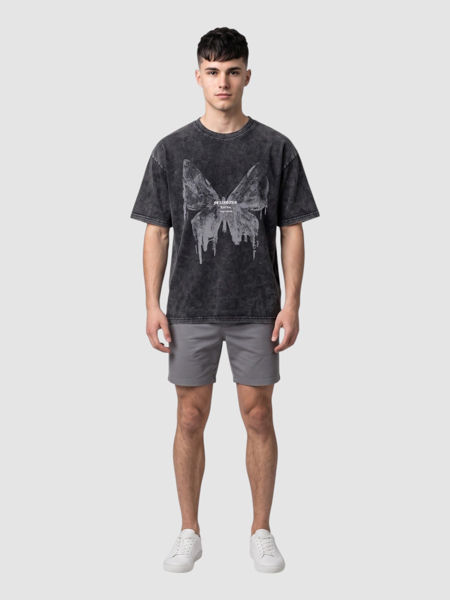 Y2K STUDIO charcoal grey acid-wash t-shirt with a butterfly graphic, worn by a male model with grey shorts