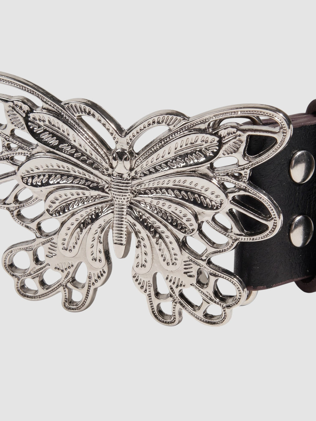 Y2K Studio black faux leather belt featuring a detailed silver filigree butterfly buckle and metal rivets.