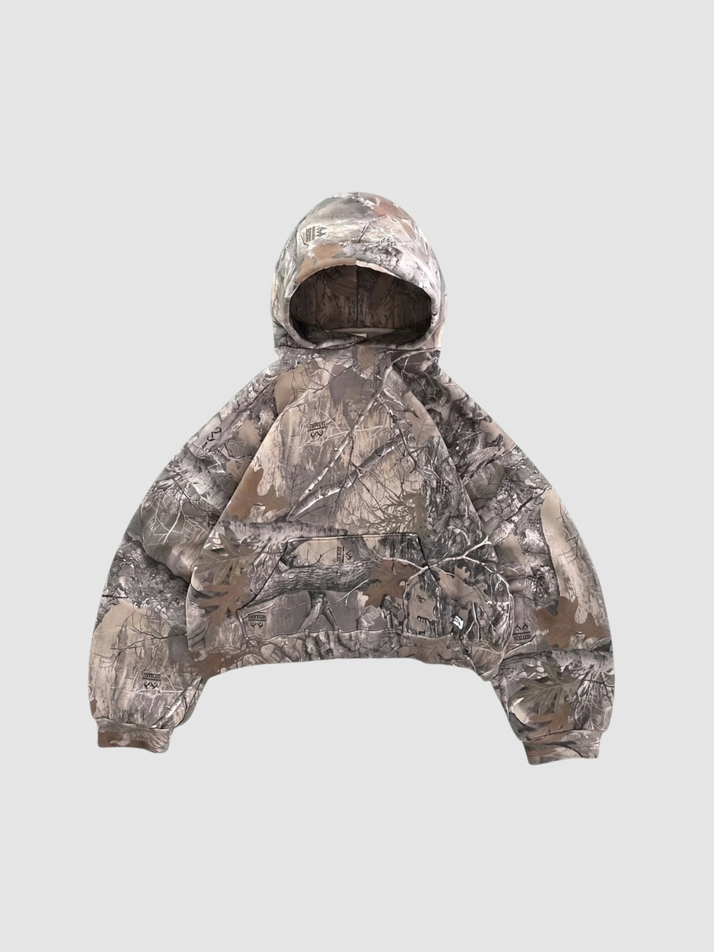 Y2K Studio cropped boxy hoodie in a brown and grey forest camouflage print with a wide fit and ribbed cuffs