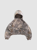 Y2K Studio cropped boxy hoodie in a brown and grey forest camouflage print with a wide fit and ribbed cuffs