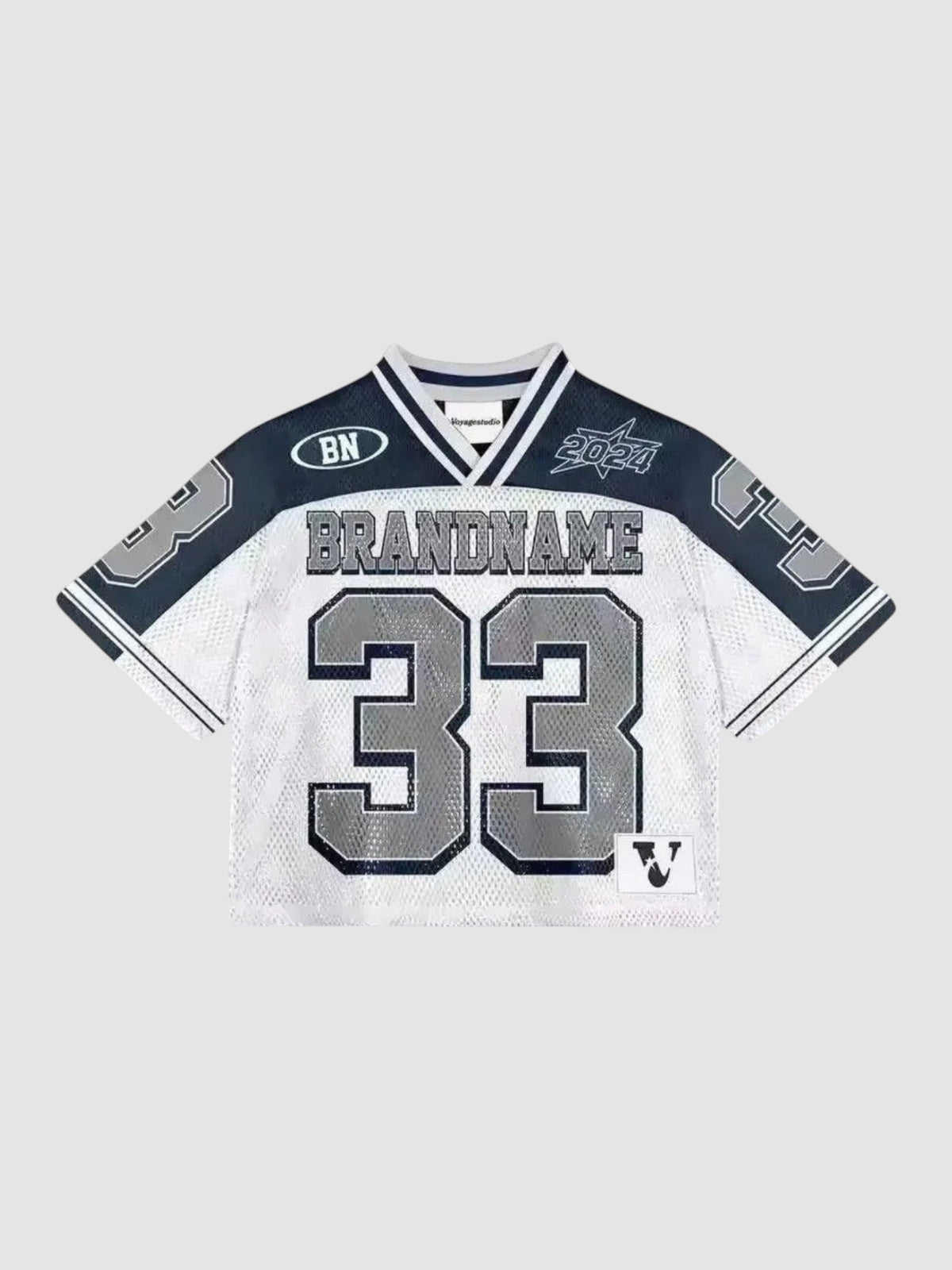 Y2K Studio cropped mesh football jersey in white and black with number 33 print, V-neck, and sporty graphic details.