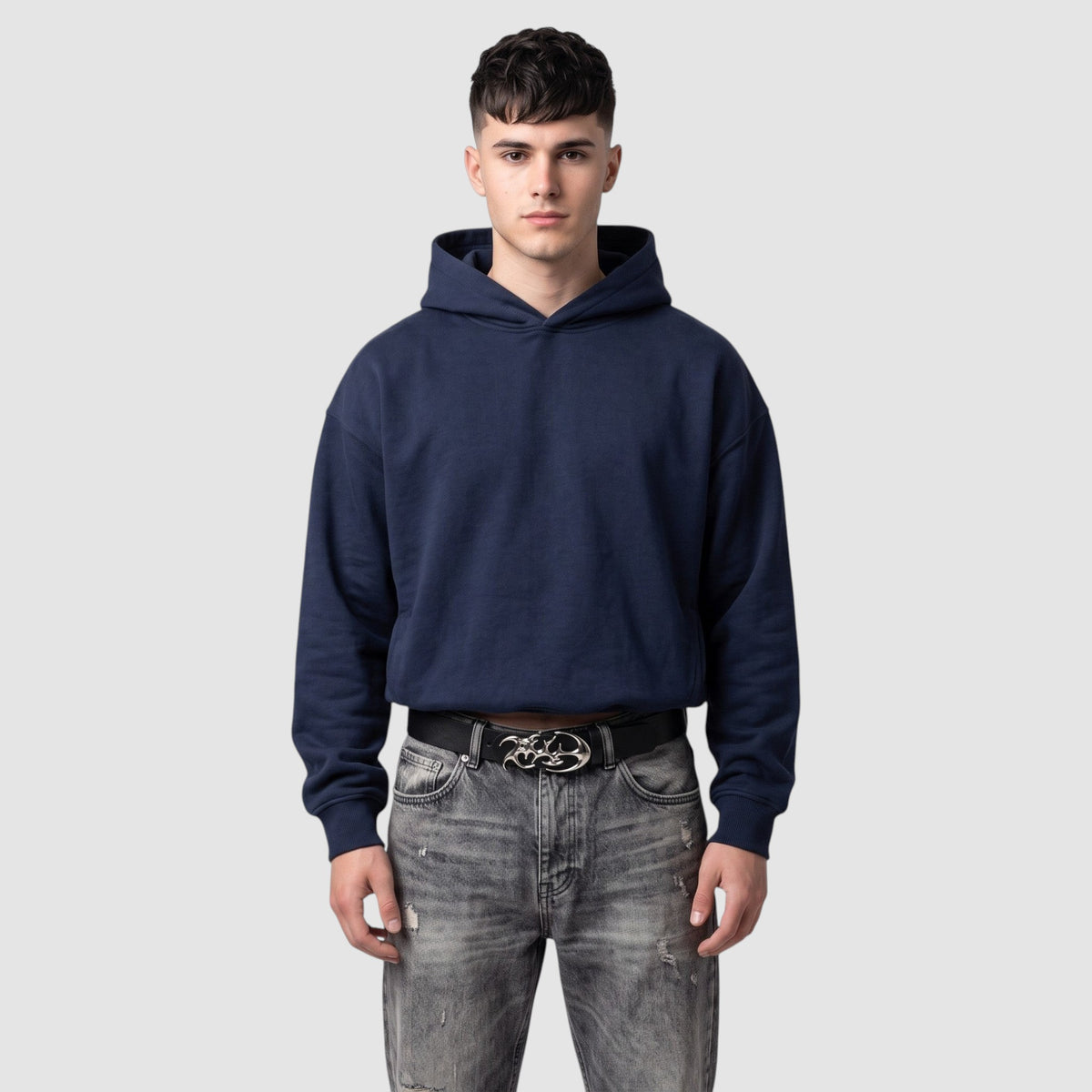 Y2K Studio Ceinture Cyber featuring a black faux leather belt with a silver flame-shaped buckle worn by a man