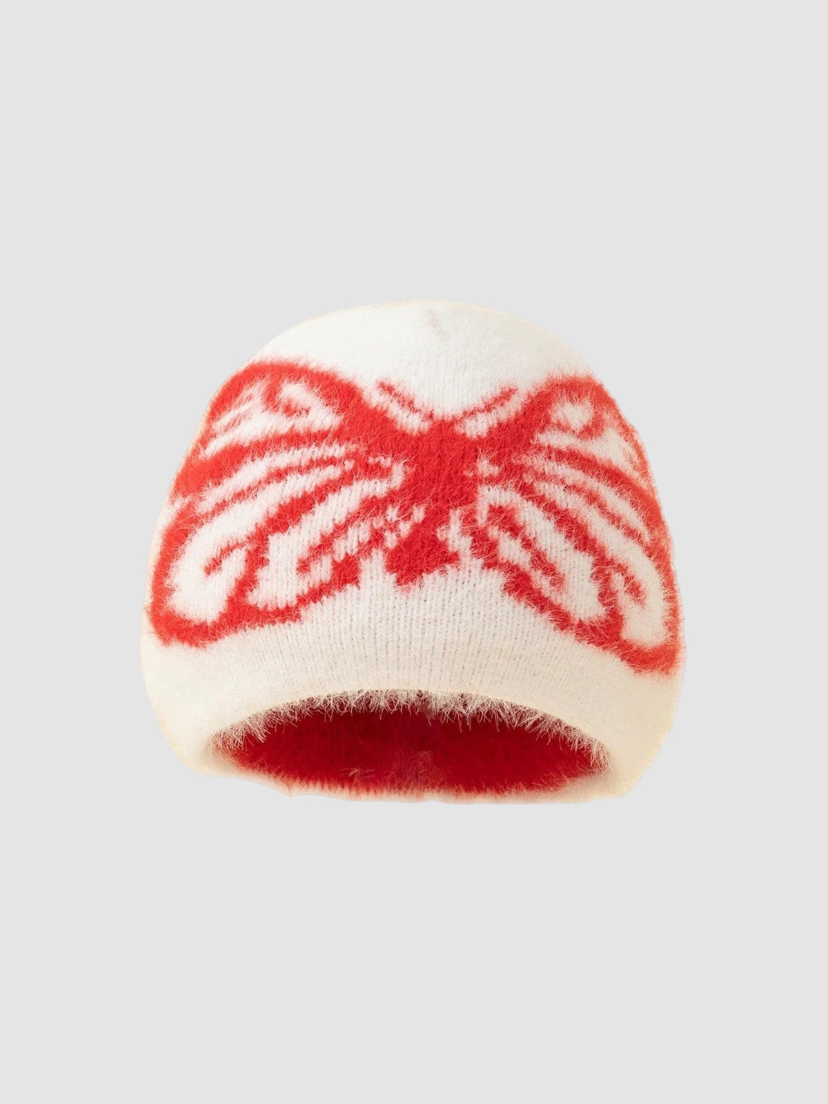 Y2K Studio fluffy white beanie featuring a bold red butterfly wing pattern in a soft, fuzzy knit texture.