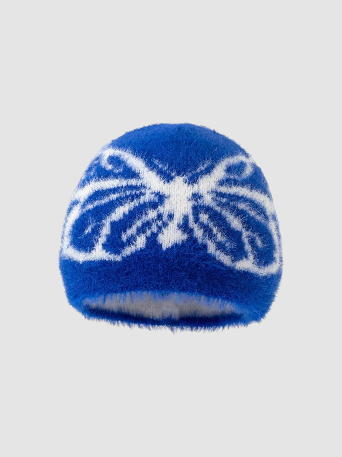 Y2K Studio fuzzy blue beanie with a white butterfly wing pattern in a soft, plush texture.