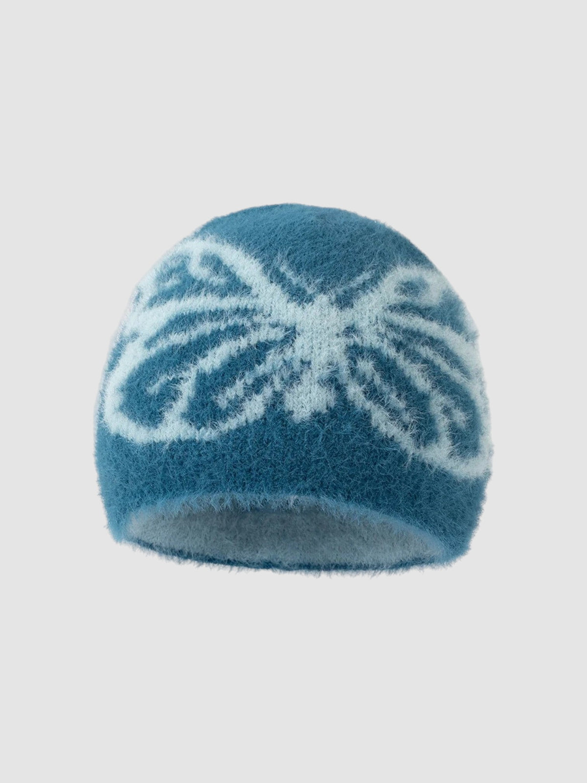 Y2K Studio fuzzy blue beanie with a white butterfly wing pattern, featuring a soft plush texture and cozy fit.