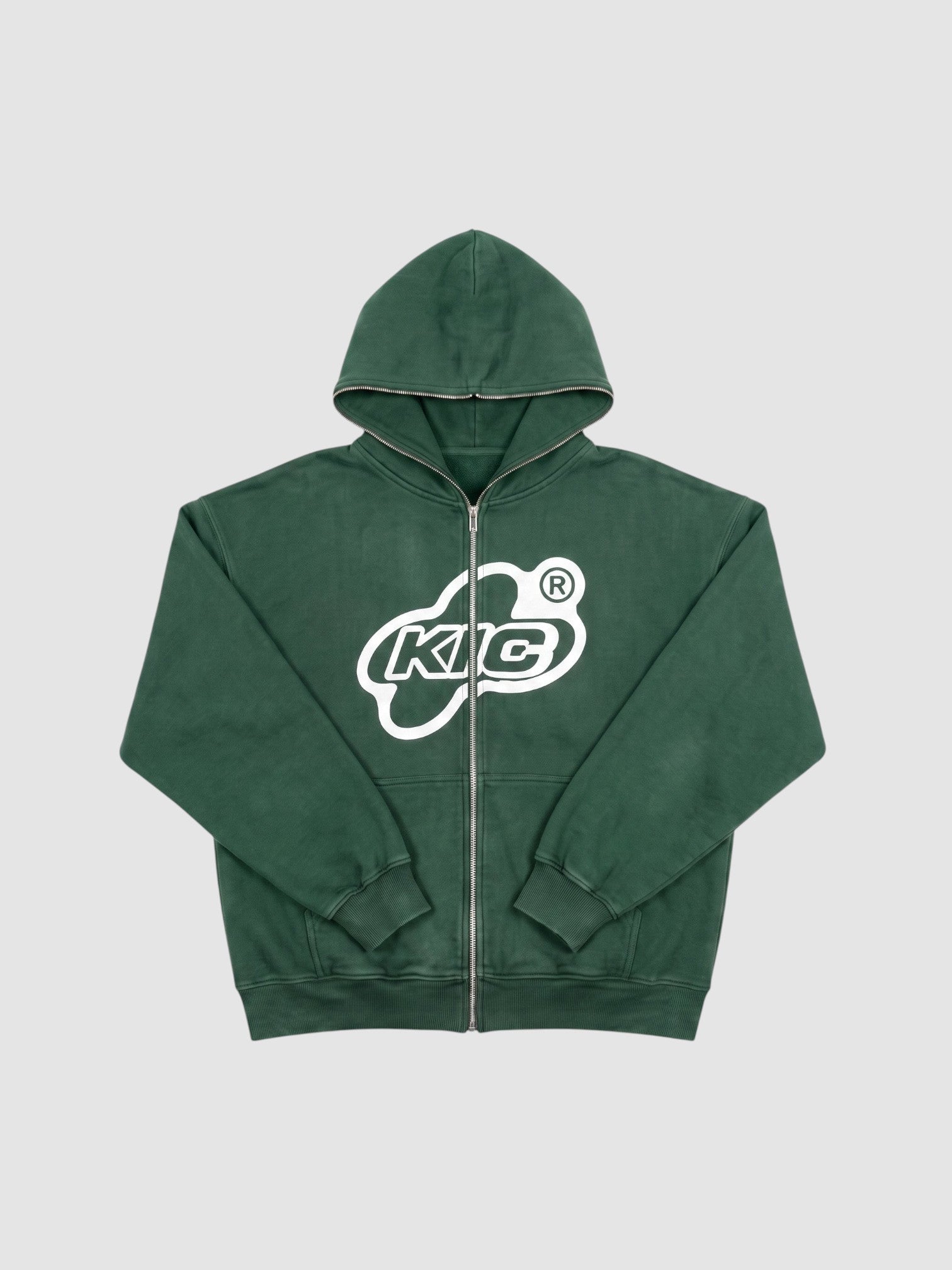 Y2K Studio oversized green zip-up hoodie with white bubble logo graphic and full-length front zipper